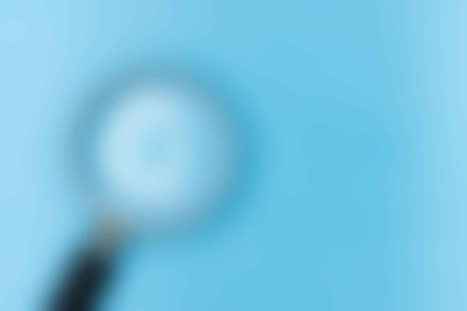 Magnifying glass on white table