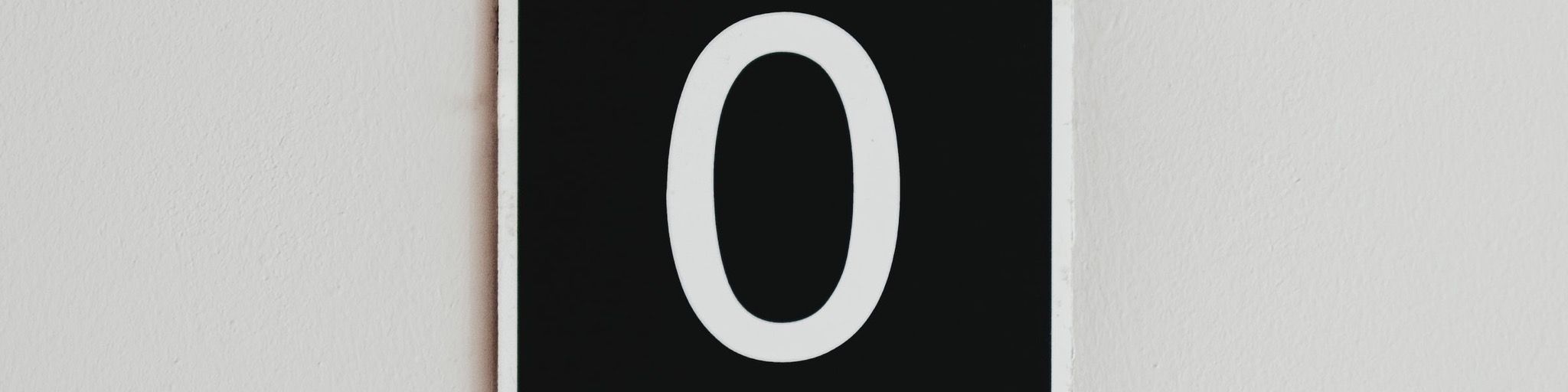 A zero on a sign on the wall