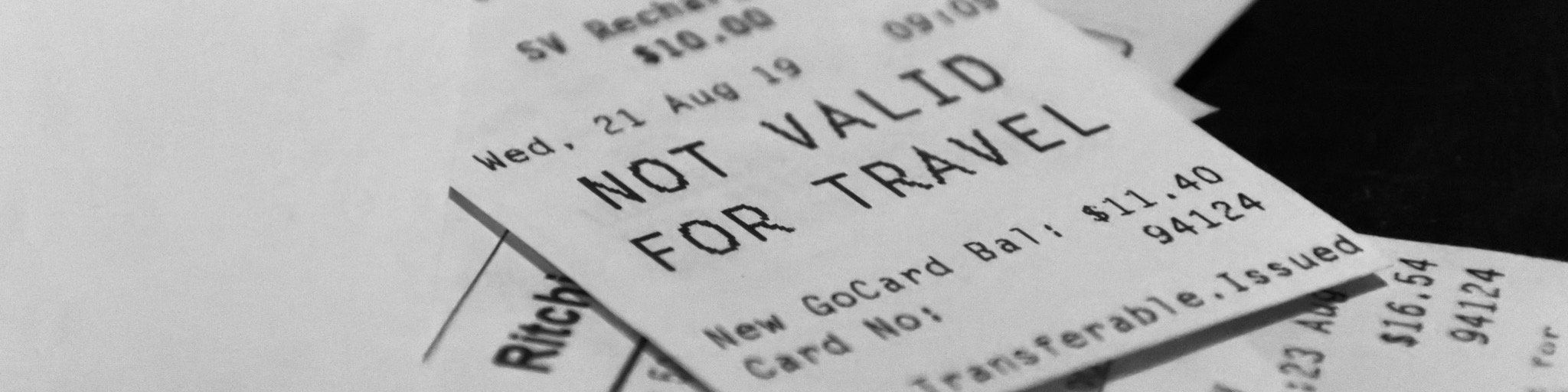 Pile of receipts one says not valid for travel