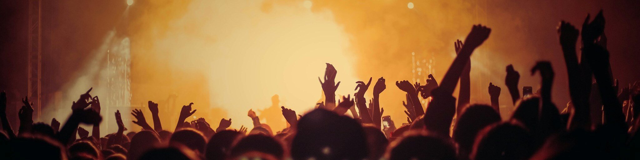 Band performing on stage in front of a crowd